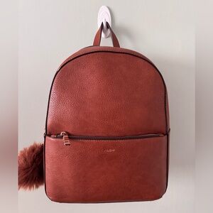 Aldo Women’s Brown Faux Leather Medium Backpack With Pompom Charm